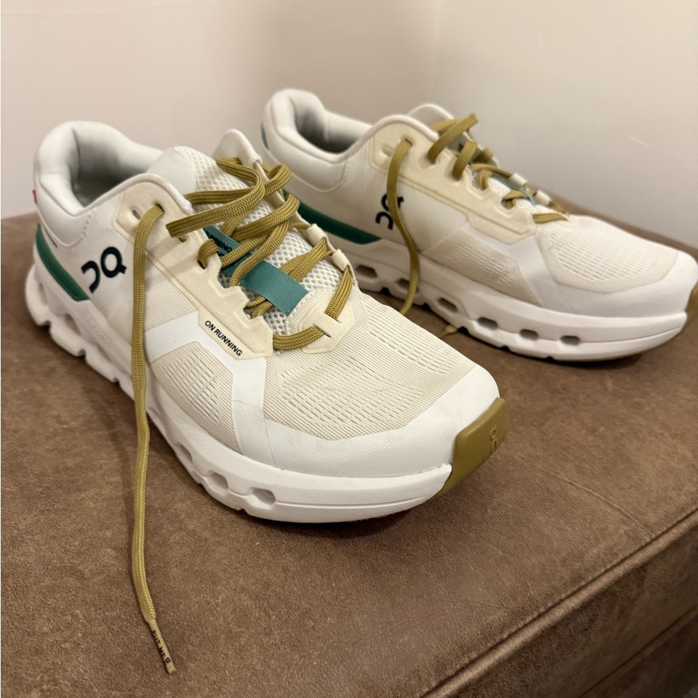 On Running White and Green Athletic Shoes with Cloud Cushioning